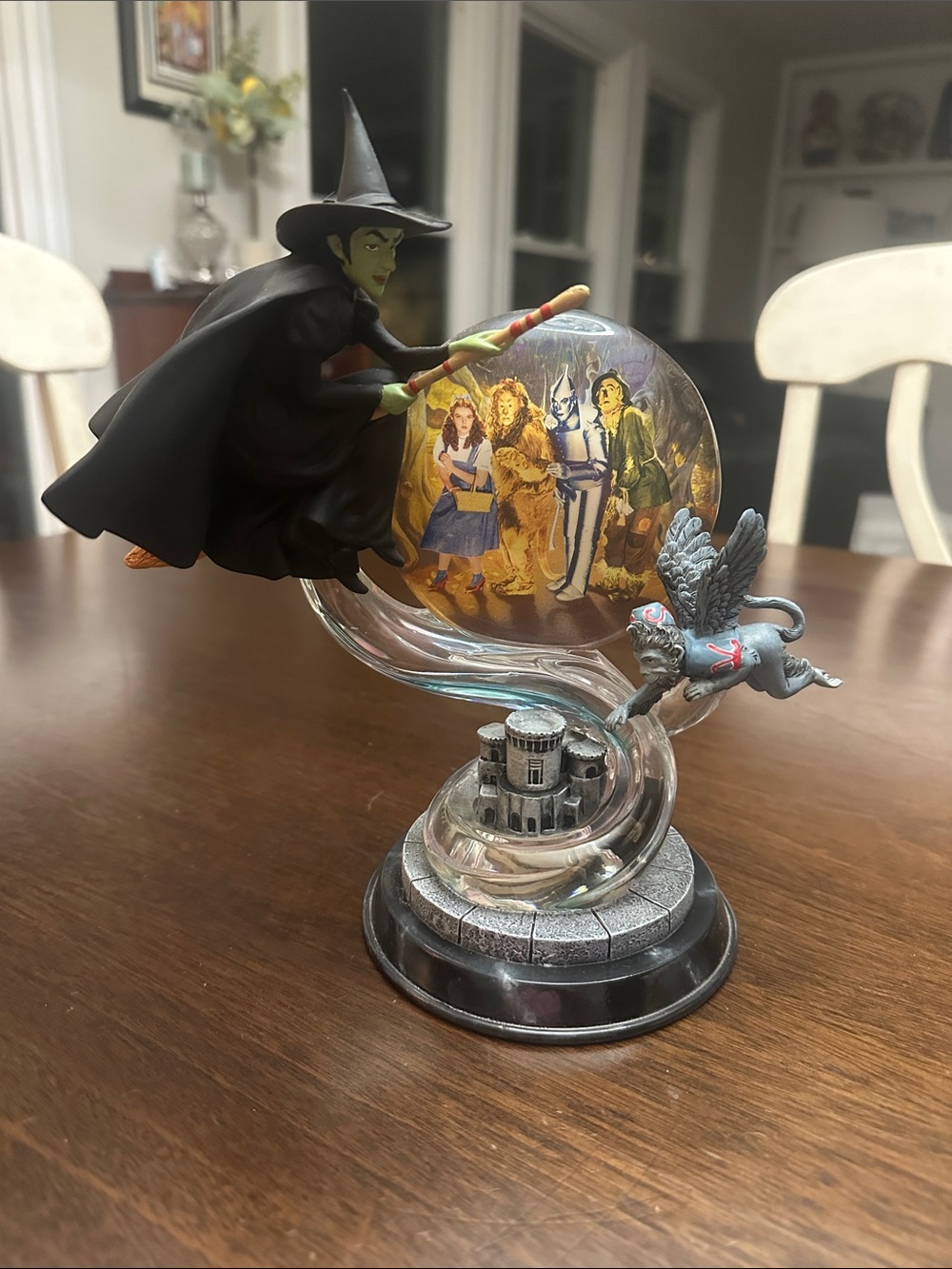 This is a collectible figurine from the "Swirling Toward Oz" collection.
